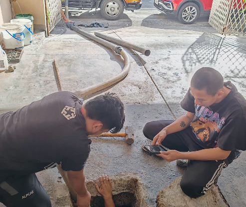 Crew working on a commercial property tank